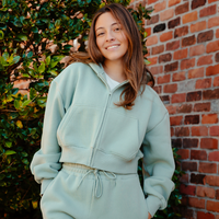 THE DROP CUT WOMEN'S CROP ZIP FRONT HOODIE