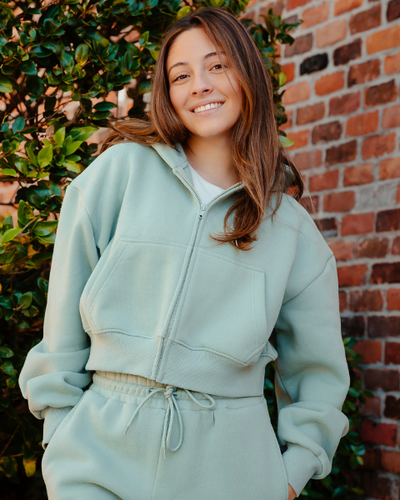 THE DROP CUT WOMEN'S CROP ZIP FRONT HOODIE
