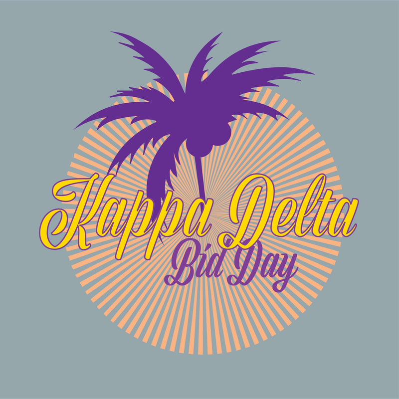 A graphic design for Kappa Delta Bid Day featuring a purple palm tree silhouette over an orange sunburst on a grey background, with 'Kappa Delta' in yellow script and 'Bid Day' in purple script.